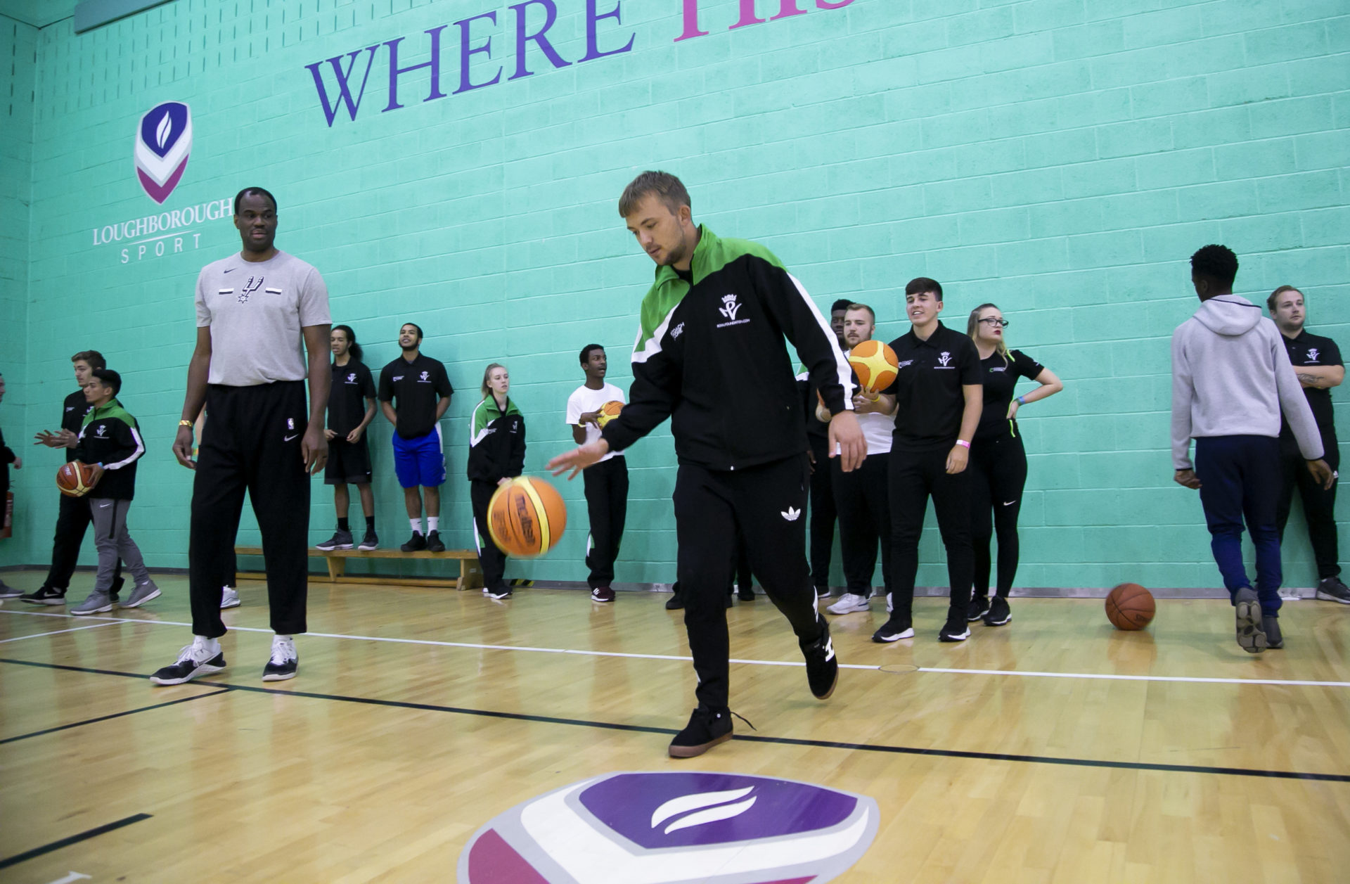 Coach Core apprentice leads a basketball session