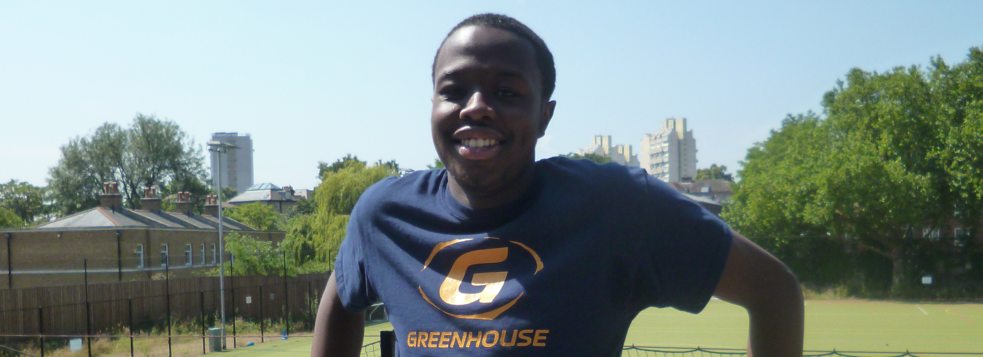 Coach Core apprentice Terrell stands in front of football pitch