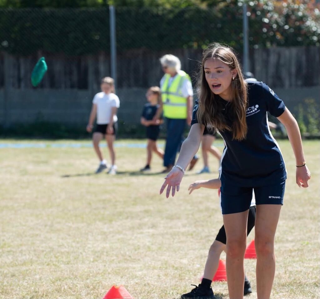 Maia coaching young people and encouraging confidence through sport